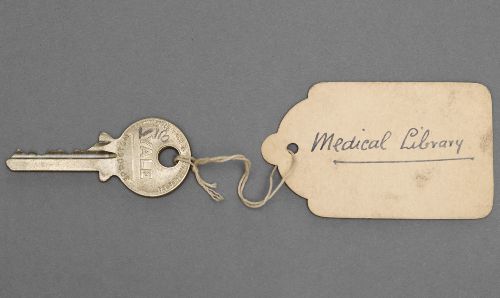 An original key for the Christie Cancer Hospital site, featuring an old handwritten label affixed by a string which reads ‘Medical Library’. 