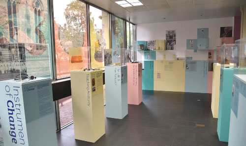 Image of Instruments of Change exhibition featuring items in display cabinets 